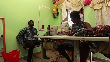 The seamstress is kissing my ass while she's taking my measurements to sew my pants
