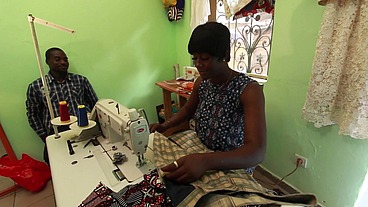 The seamstress is kissing my ass while she's taking my measurements to sew my pants