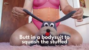 Butt in a bodysuit to squash the stuffed dog