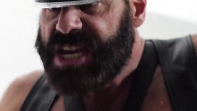 Bearded hunk in a kinky outfit dominates and fucks a stud