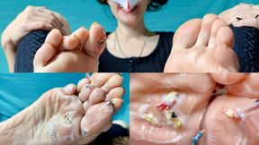 The Giantess goddess caresses tiny people with her feet in cream