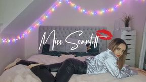 Scarlett's black leather pants & silver satin blouse tease