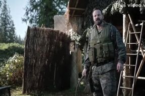 Shirtless Stephen Amell being flogged