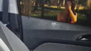 Risky redhead strokes in the street caught on camera