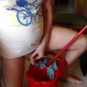 John is peeing into the cleaning bucket