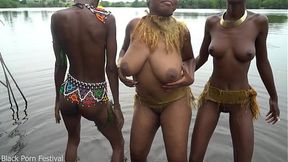 Raw documentary footages with 3 African tribe girls dancing in the river in the forrest
