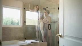 Brandi Love pleasures young blondie in the bathroom