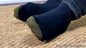 Handsome dude with long hair Nathaniel shows off his feet