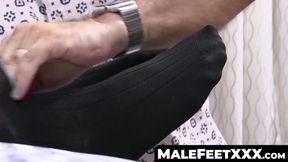 Hunky dude enjoys skilled foot massage from his friend
