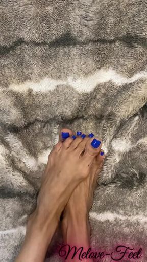 Melove Showing Her Blue Nail Polish on Her Small Feet