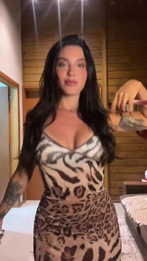 Sexy brunette in leopard print dress