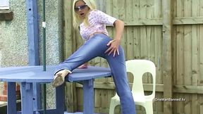 Not urinating on her pants, but rather splashing her tight denim with golden liquid