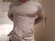 stripping and flexing through my hoodie, tanktop, briefs flexing my muscles