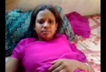 Dark skin authentic amateur Desi lady on the bed filmed