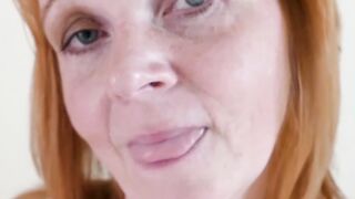 Red haired mature lady Elisabeth Kardon rubbing wet pussy