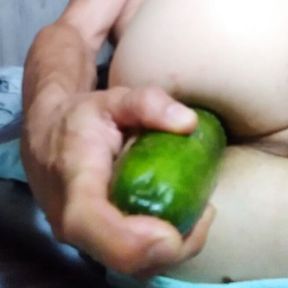 Anal playing with massive cucumber