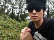 Cute French-Asian gay twink jerks off his shaved cock outside cums thick cum sticking to his fingers