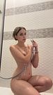 Naked and soaked in the shower, legs spread and shower head in hand while staring seductively. OnlyFans.