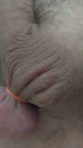 Catching my balls with an elastrator and tightly laced   Clip 1