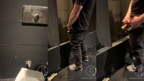 in a club, boy enters the toilets, opens a cubicle and catch a guy about to pee.