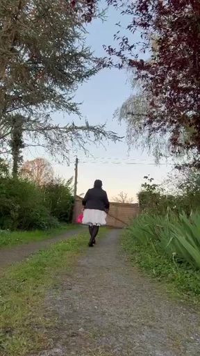 In casual attire with a white skirt one evening