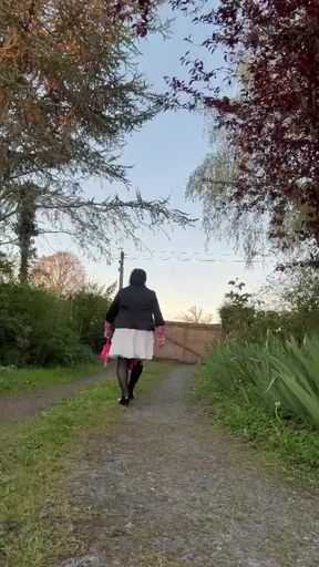 In casual attire with a white skirt one evening