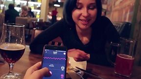 Teen lets her boyfriend control her pussy through remote vibrator in bar