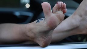 Resting Feet out of the Car Window