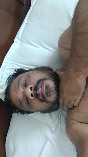 Indian Daddy Lying on the Bed Teasing and Posing for You