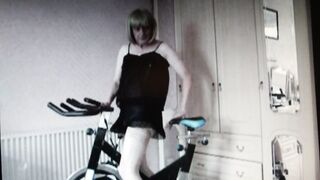 Amateur MILF with a big ass and lingerie gets off on a workout bike in homemade video