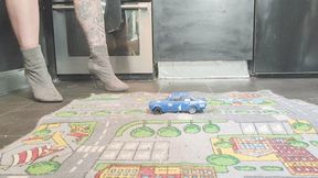 MissaRaeBerry toy car crush she crushes 2 old cars ford and Toyota MR2 in high heeled boots close ground view