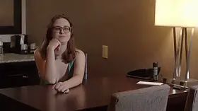 An artist gets painted by a suspended model