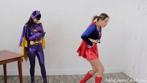 Remote Controlled Heroines: Mesmerized Embarrassment Cosplay starring Nikki Brooks as Supergirl and Cali Logan as Batgirl (mob)