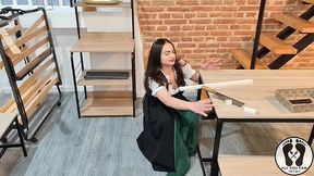 sensual latina carpenter cutting wood in a dirndl