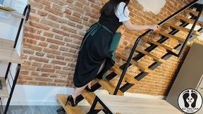 sensual latina carpenter cutting wood in a dirndl