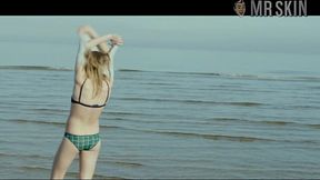 Playful and sexy Cara Delevingne looks more than alluring in her bikini on the beach