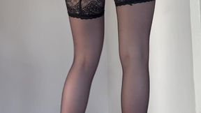The secretary shows her stockings in shoes and a leather skirt
