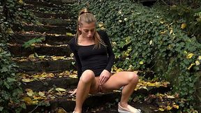 Sporty and young white girl outdoors pisses on the stairs