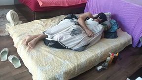 Sensual massage of a sexy couple with oil on the body. Foreplay in the bedroom with an amateur couple.