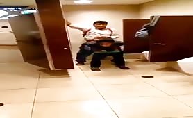 Young latinos fucking in a public bathroom