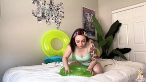 Tattooed girl deflates her favorite inflatable toys