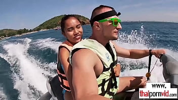 Amateur Thai teen Cherry sucking a big white dick on a jet ski