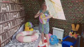 Alla takes out a lot of small inflatable toys while cleaning her room