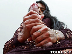 Busty trans Sabrina Loppes plays with her big cock and swollen balls