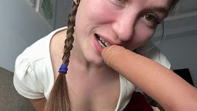 Skinny teen teases with her tiny tits and sucking dildo