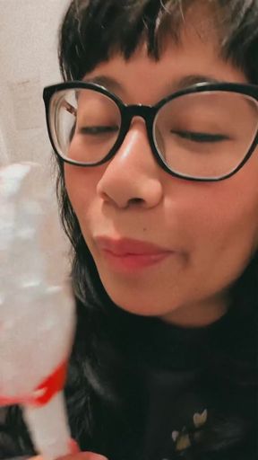 Woman blowing bubble gum
