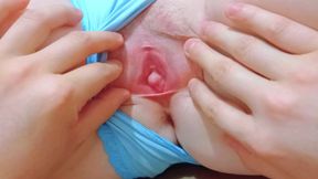 I pull her panties to the side and open her pussy lips to the extreme