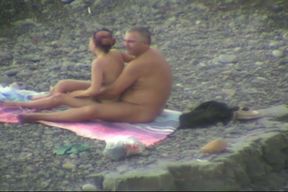 Lewd plump couple had fun while spooning each other on the beach