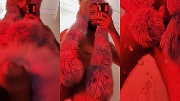 Red fluffy devil with a big uncut cock fills the mirror with cum