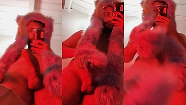 Red fluffy devil with a big uncut cock fills the mirror with cum